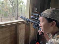 Olivia looking
                  out north window, hoping for more deer